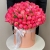 Композиция в шляпной коробке из 113 пионов Корал Шарм в Егорьевске
